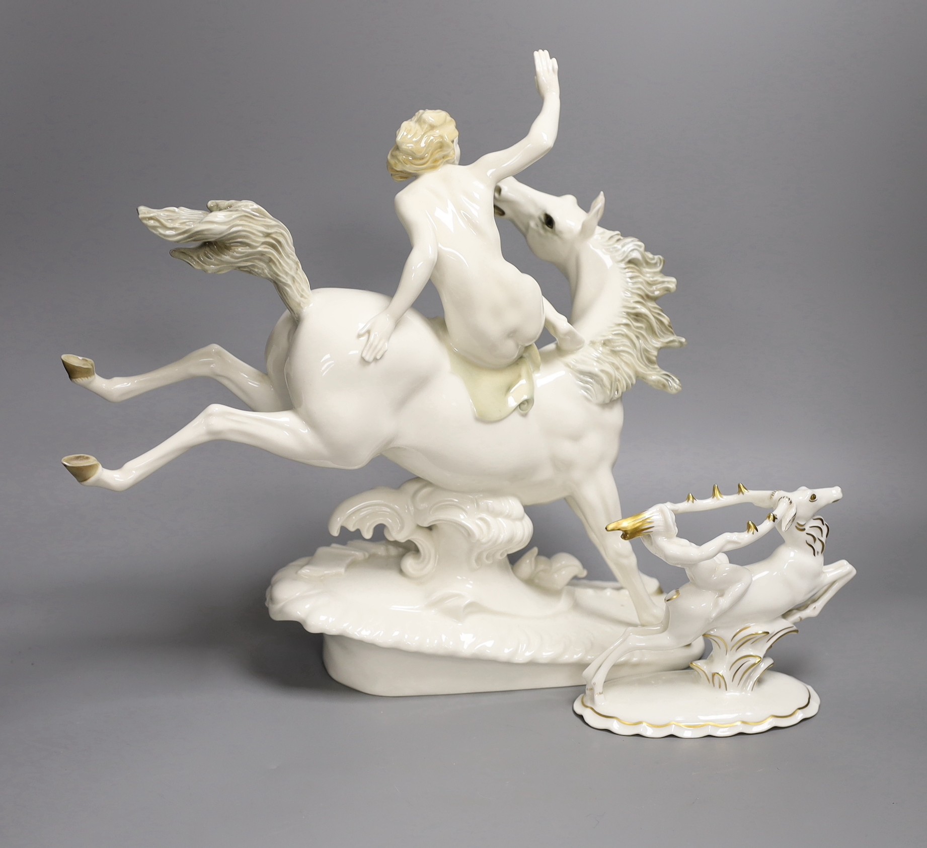 A Hutschenreuter equestrian group and another smaller group, 33cm